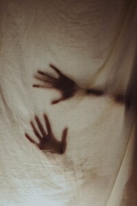 ghosts hands behind sheet