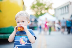 a child eating a palisade peach