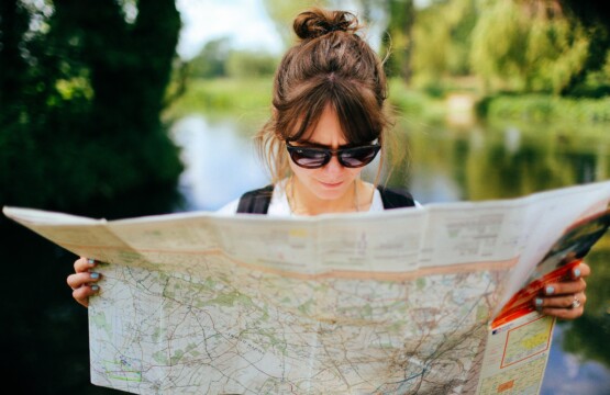 woman reading map