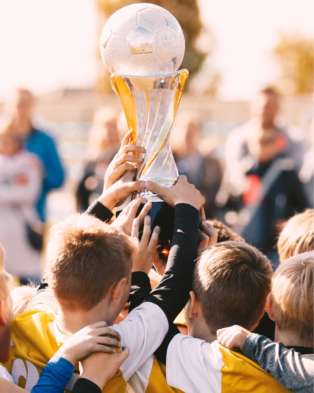 team holding soccer trophy