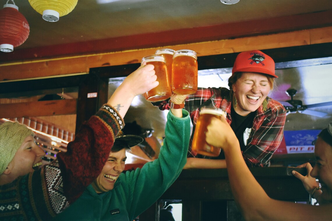 Group of friends toasting beer